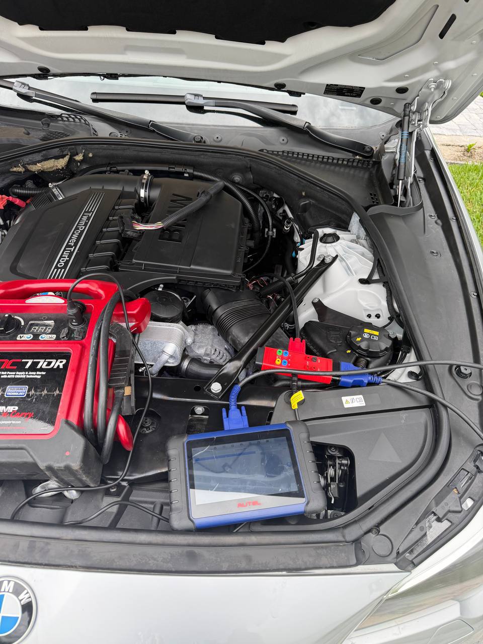 Vehicle electrical diagnostics under a BMW hood